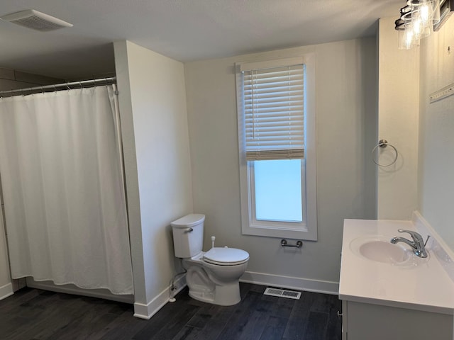 436 Adams St SE, Hutchinson, MN 55350 - full bath with baseboards, wood finished floors, and visible vents