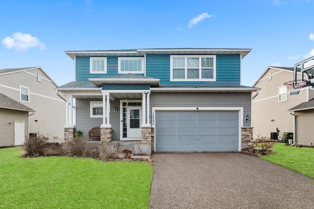 view of front of property with a garage, aphalt driveway, stone siding, a porch, and a front yard