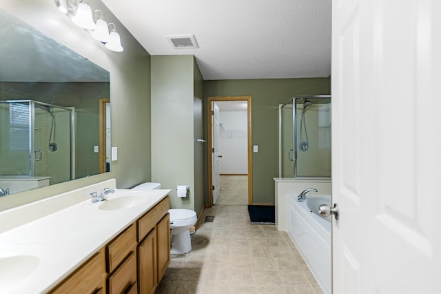full bath featuring double vanity, visible vents, a sink, a garden tub, and a stall shower