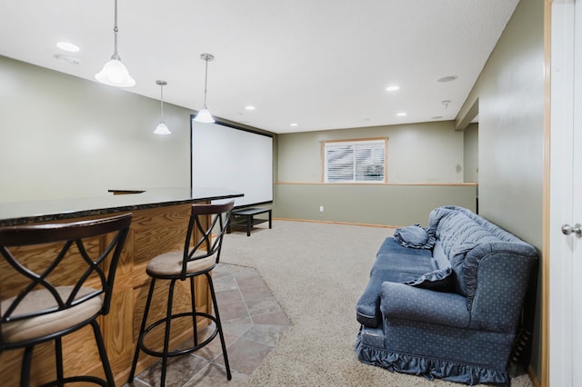 bar featuring carpet, pendant lighting, and recessed lighting