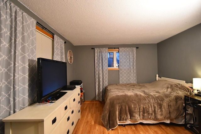 1164 Hawthorn St, Red Wing, MN 55066 - bedroom with light wood-style flooring and a textured ceiling