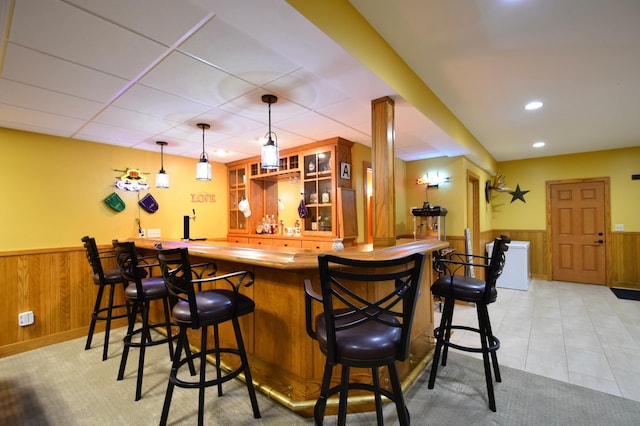 1164 Hawthorn St, Red Wing, MN 55066 - indoor wet bar with wainscoting, wood walls, hanging light fixtures, and recessed lighting