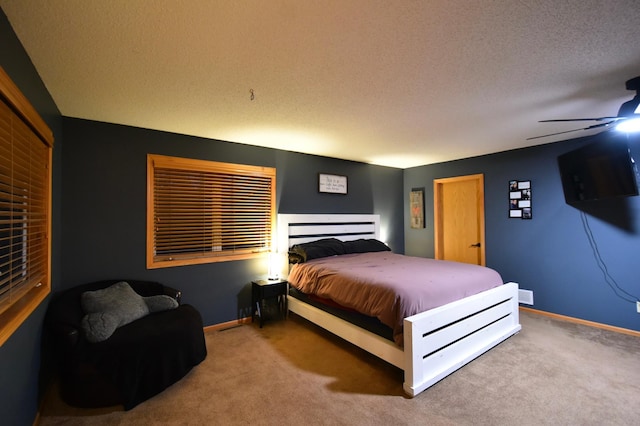 1164 Hawthorn St, Red Wing, MN 55066 - carpeted bedroom with a textured ceiling, baseboards, and a ceiling fan