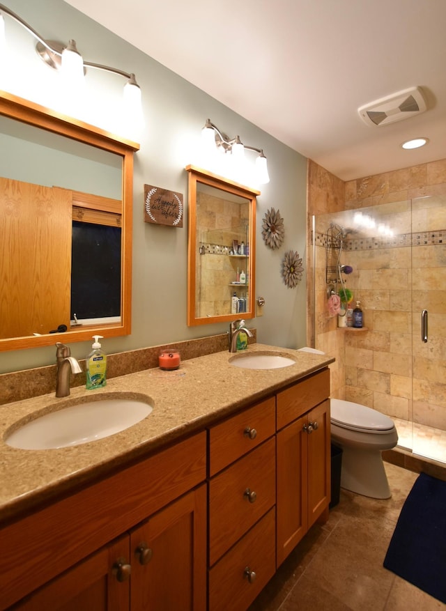 1164 Hawthorn St, Red Wing, MN 55066 - bathroom with double vanity, a shower stall, toilet, and tile patterned floors