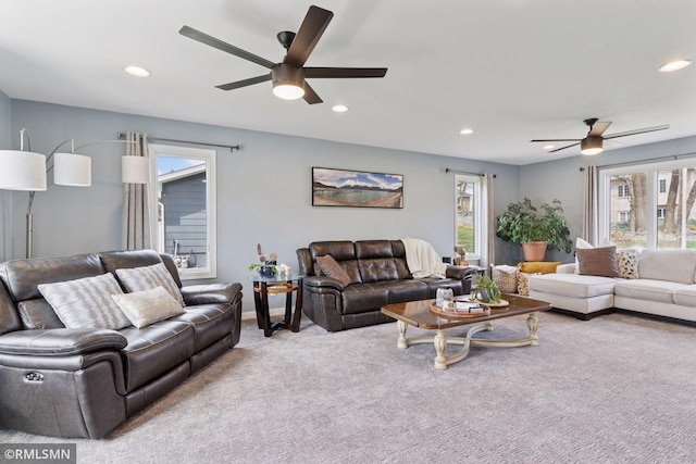 living area featuring recessed lighting, ceiling fan, and a healthy amount of sunlight