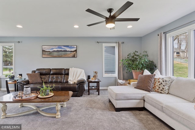 carpeted living area featuring baseboards, a ceiling fan, and recessed lighting