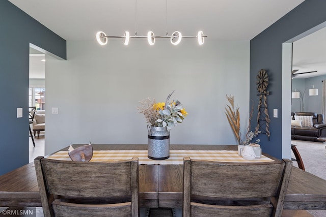 dining area featuring ceiling fan