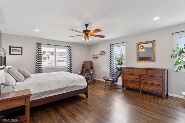 bedroom with recessed lighting, baseboards, multiple windows, and wood finished floors