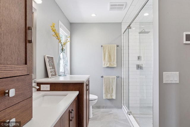 full bathroom with visible vents, a stall shower, baseboards, toilet, and marble finish floor