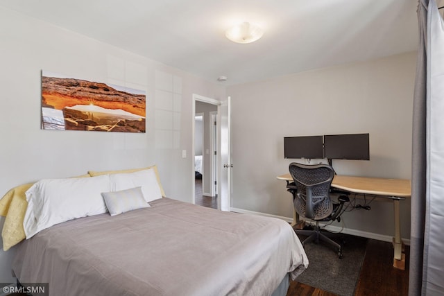 bedroom with wood finished floors