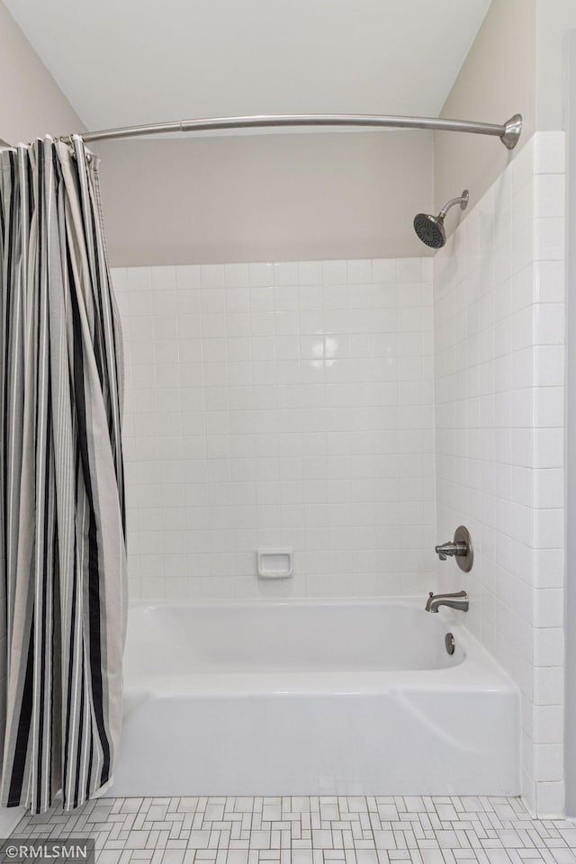bathroom featuring shower / bathtub combination with curtain