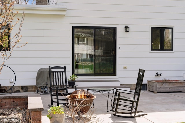 view of patio / terrace with a fire pit