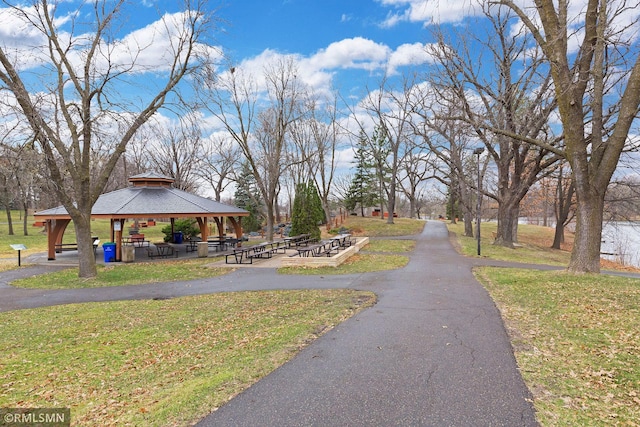 view of property's community with a gazebo and a yard