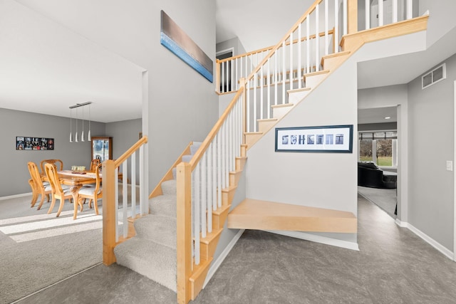 5214 381st Ln, North Branch, MN 55056 - staircase featuring visible vents, carpet, and baseboards