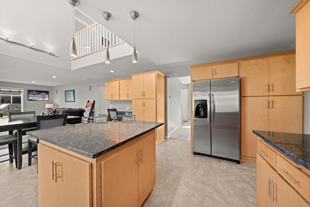 5214 381st Ln, North Branch, MN 55056 - kitchen with dark stone countertops, a center island, light brown cabinetry, recessed lighting, and stainless steel refrigerator with ice dispenser