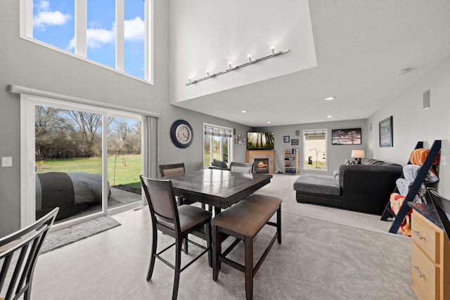 5214 381st Ln, North Branch, MN 55056 - dining room featuring a healthy amount of sunlight, recessed lighting, and a warm lit fireplace