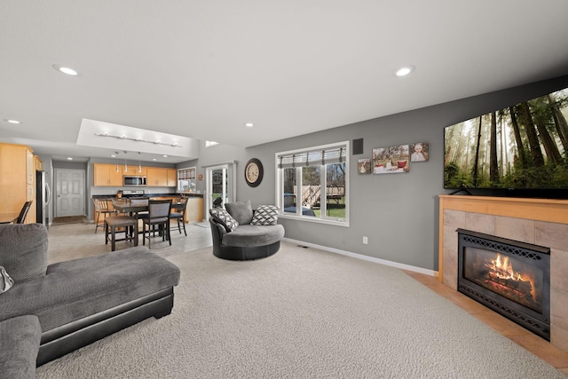 5214 381st Ln, North Branch, MN 55056 - living area featuring recessed lighting, a tile fireplace, and baseboards