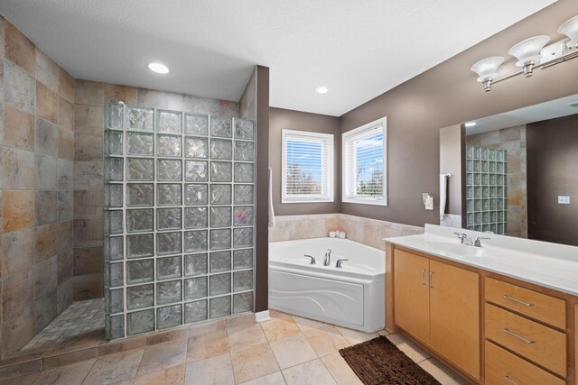 5214 381st Ln, North Branch, MN 55056 - full bathroom with recessed lighting, a walk in shower, a garden tub, and vanity