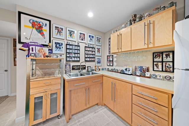 5214 381st Ln, North Branch, MN 55056 - kitchen featuring freestanding refrigerator, light tile patterned flooring, light countertops, and a sink
