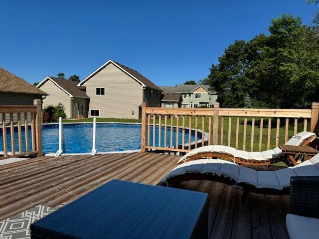5214 381st Ln, North Branch, MN 55056 - wooden deck with a fenced in pool