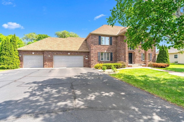 5214 381st Ln, North Branch, MN 55056 - traditional home with brick siding, an attached garage, a front yard, driveway, and roof with shingles