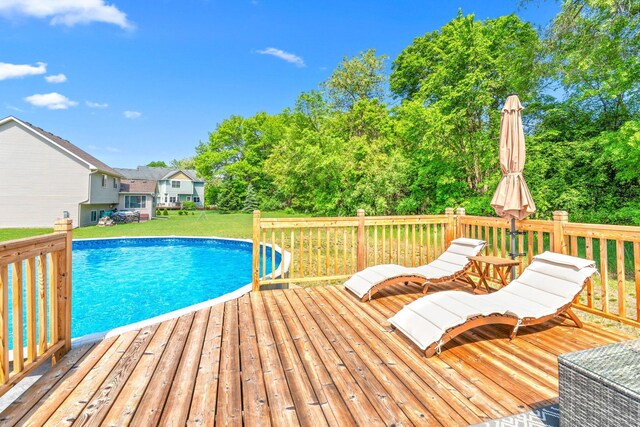 5214 381st Ln, North Branch, MN 55056 - swimming pool with a deck, a yard, and view of scattered trees