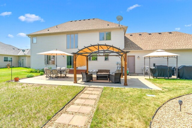 5214 381st Ln, North Branch, MN 55056 - rear view of property featuring a gazebo, outdoor lounge area, a patio, a lawn, and a shingled roof