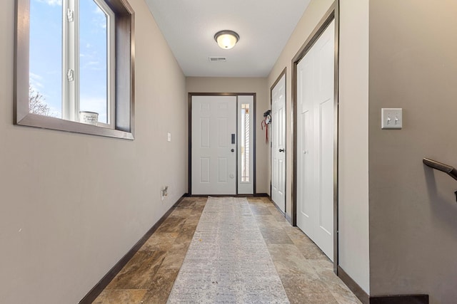 1101 8th Ave SW, Isanti, MN 55040 - entrance foyer featuring stone finish floors and baseboards