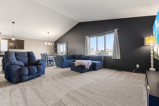 1101 8th Ave SW, Isanti, MN 55040 - living area with a chandelier, carpet flooring, and vaulted ceiling