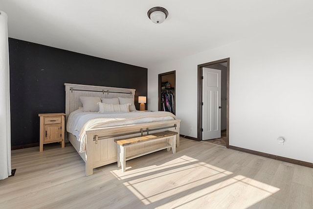 1101 8th Ave SW, Isanti, MN 55040 - bedroom with light wood-style flooring and baseboards