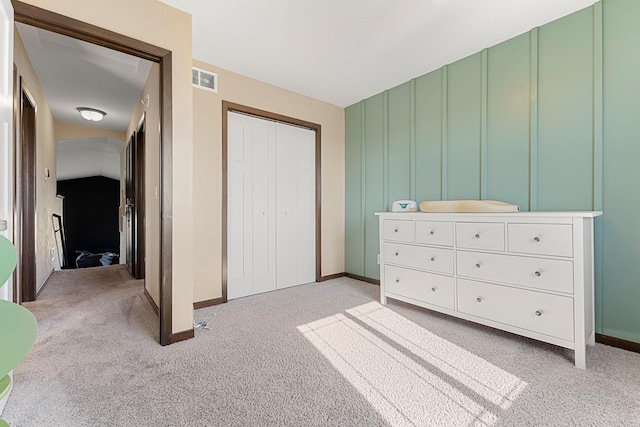 1101 8th Ave SW, Isanti, MN 55040 - bedroom featuring light carpet, baseboards, and a closet