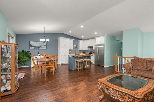 living area featuring baseboards, dark wood finished floors, a chandelier, and lofted ceiling