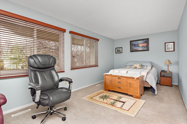 bedroom featuring visible vents, carpet flooring, and baseboards