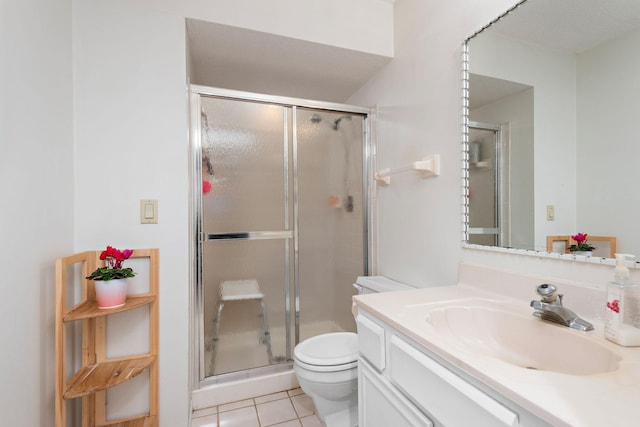 full bath featuring vanity, tile patterned flooring, a shower stall, and toilet