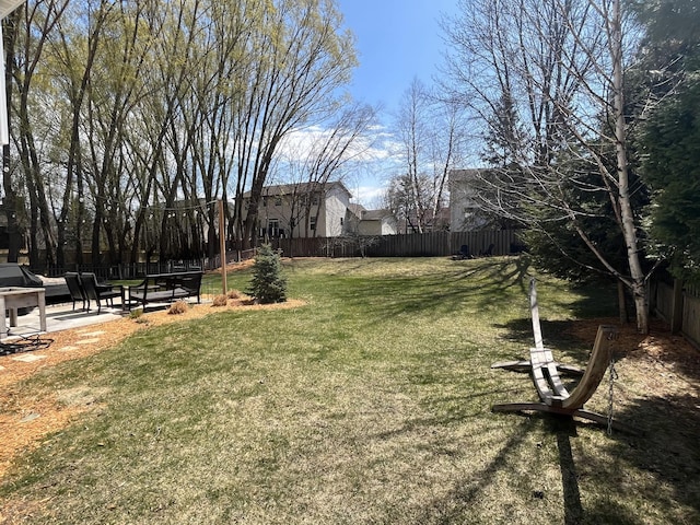 view of yard featuring a patio and a fenced backyard