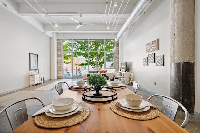 700 Washington Ave N Unit 210, Minneapolis, MN 55401 - dining room featuring a ceiling fan and a towering ceiling