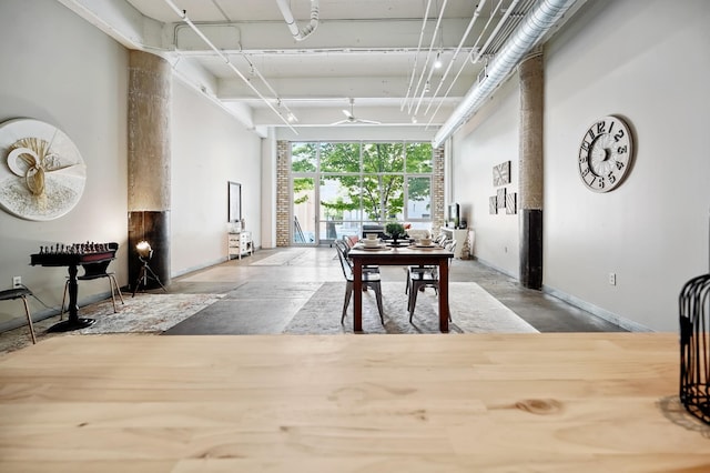 700 Washington Ave N Unit 210, Minneapolis, MN 55401 - dining area with concrete flooring and baseboards