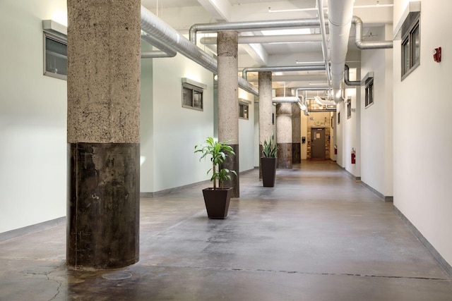 700 Washington Ave N Unit 210, Minneapolis, MN 55401 - hall featuring concrete flooring and baseboards