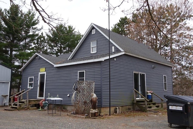 338 40th St, Clear Lake, WI 54005 - rear view of property with entry steps and roof with shingles