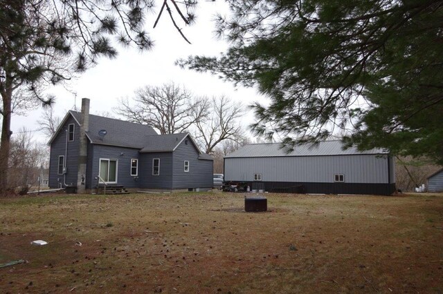 338 40th St, Clear Lake, WI 54005 - back of property featuring entry steps and a chimney