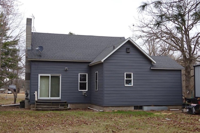 338 40th St, Clear Lake, WI 54005 - rear view of property with a chimney, entry steps, and a shingled roof