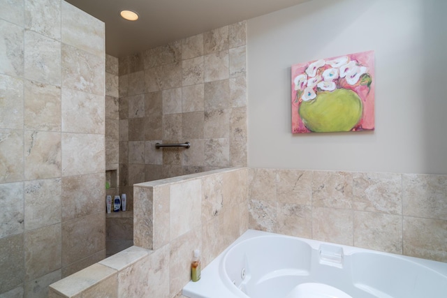 full bathroom featuring recessed lighting and a tub with jets
