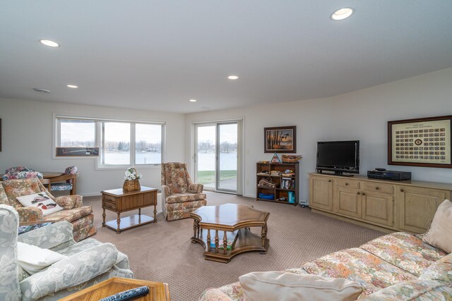 living room featuring recessed lighting and light colored carpet