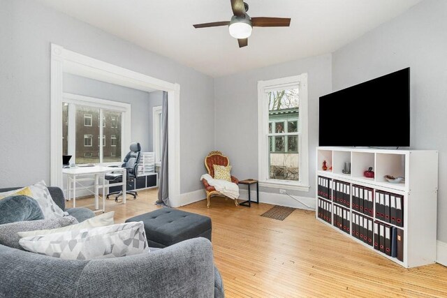 2530 Pleasant Ave, Minneapolis, MN 55404 - living room featuring baseboards, a ceiling fan, and wood finished floors