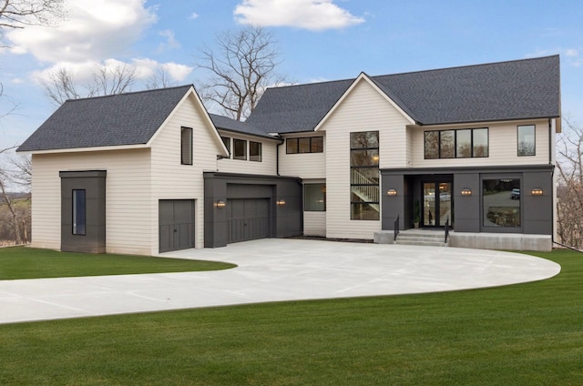 5010 Millie Rd SW, Rochester, MN 55902 - view of front facade with concrete driveway, a shingled roof, a front yard, and a garage