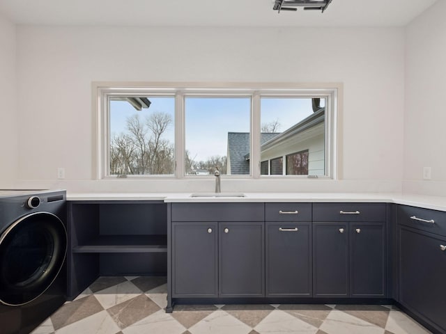 5010 Millie Rd SW, Rochester, MN 55902 - clothes washing area featuring a sink, light floors, cabinet space, and washer / clothes dryer