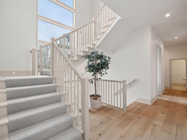 5010 Millie Rd SW, Rochester, MN 55902 - stairway featuring baseboards, plenty of natural light, recessed lighting, and wood finished floors