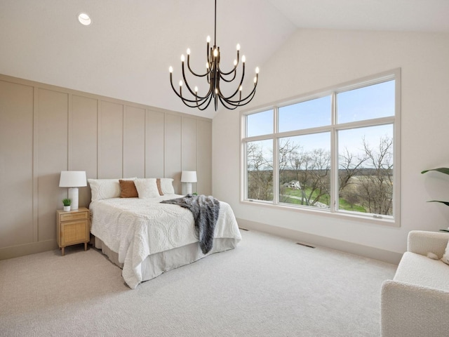 5010 Millie Rd SW, Rochester, MN 55902 - bedroom featuring an inviting chandelier, visible vents, a decorative wall, lofted ceiling, and light colored carpet