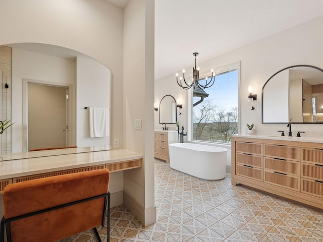 5010 Millie Rd SW, Rochester, MN 55902 - full bathroom featuring an inviting chandelier, a sink, two vanities, and a soaking tub