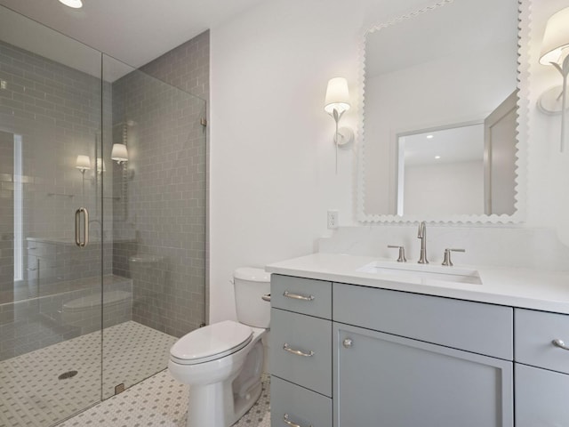 5010 Millie Rd SW, Rochester, MN 55902 - bathroom featuring vanity, toilet, recessed lighting, and a stall shower